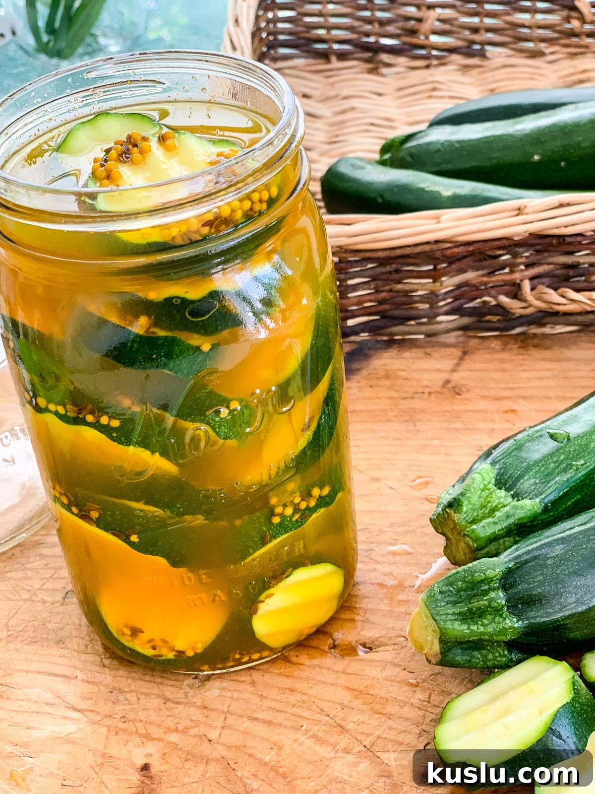 Quick Refrigerator Zucchini Pickles — No Canning Needed 12 Zucchini pickles on a cutting board