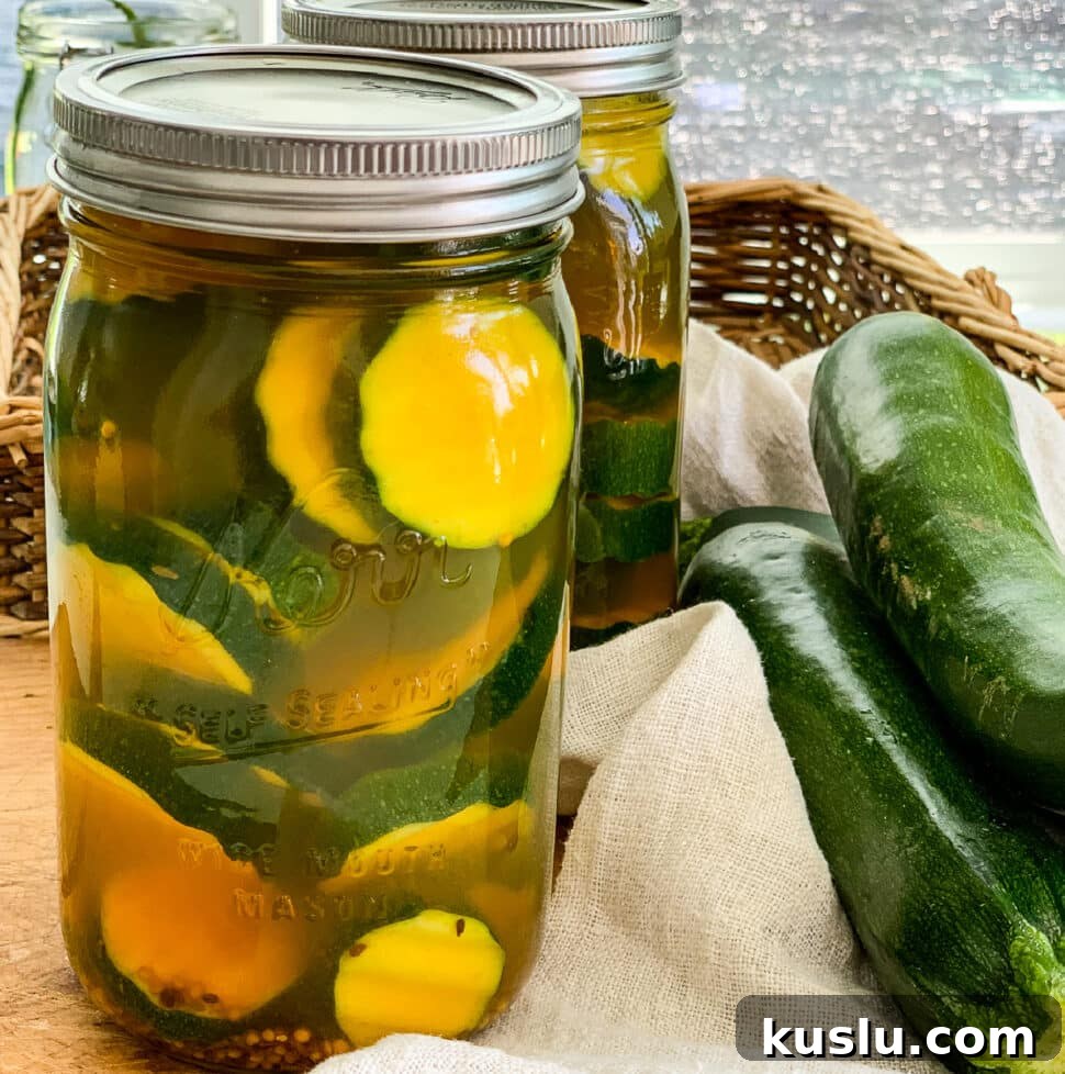 Quick Refrigerator Zucchini Pickles — No Canning Needed 18 Close up of zucchini pickles in a quart glass mason jar.