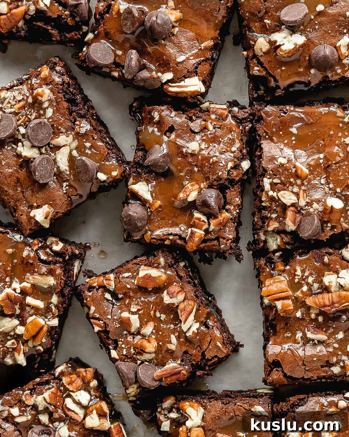 Turtle brownies are rich and fudgy brownies topped with a layer of salted caramel sauce, chopped pecans and sweet chocolate chips. These caramel brownies are the ultimate indulgence and taste just like the turtle candy. 