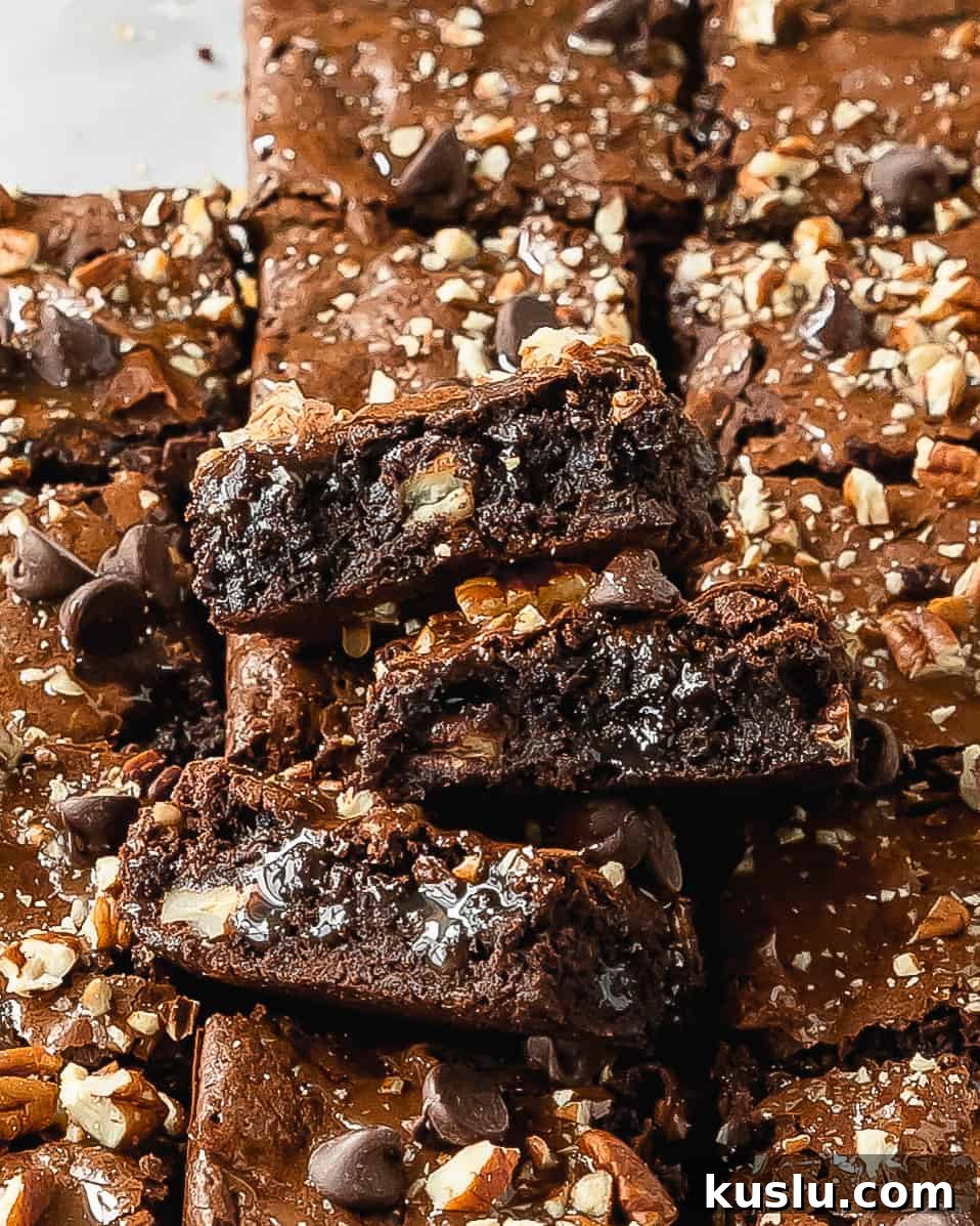Turtle brownies are rich and fudgy brownies topped with a layer of salted caramel sauce, chopped pecans and sweet chocolate chips. These caramel brownies are the ultimate indulgence and taste just like the turtle candy. 