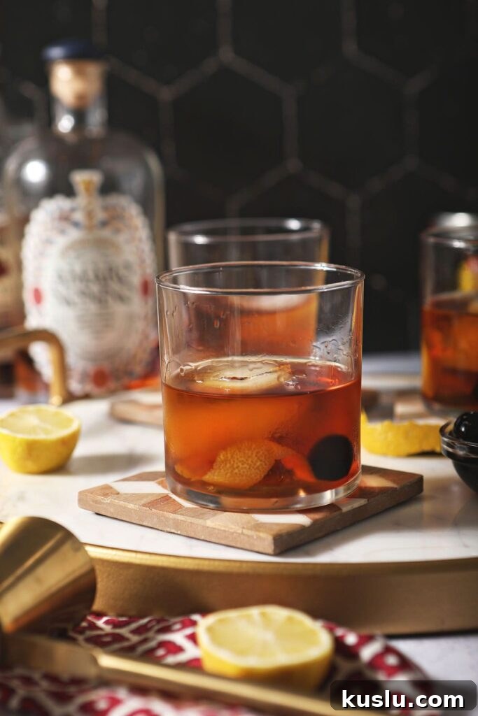 Busted Pipe Bourbon & Amaro Cocktail Recipe 2 Three amaro cocktails on wooden trivets with lemons