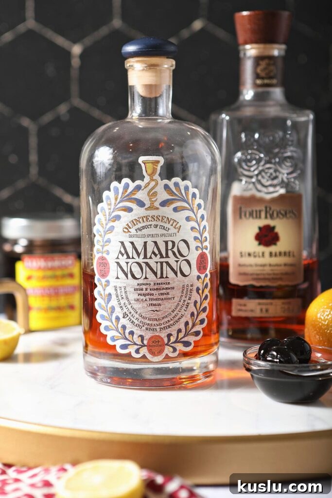 Busted Pipe Bourbon & Amaro Cocktail Recipe 3 Bottles of amaro and bourbon with luxardo cherries and a lemon