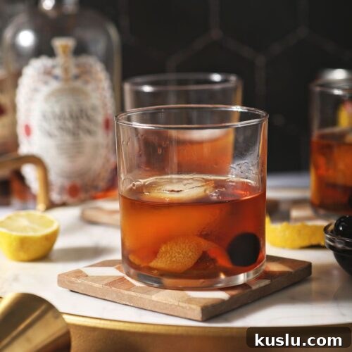 Busted Pipe Bourbon & Amaro Cocktail Recipe 7 Three amaro cocktails on wooden trivets with lemons
