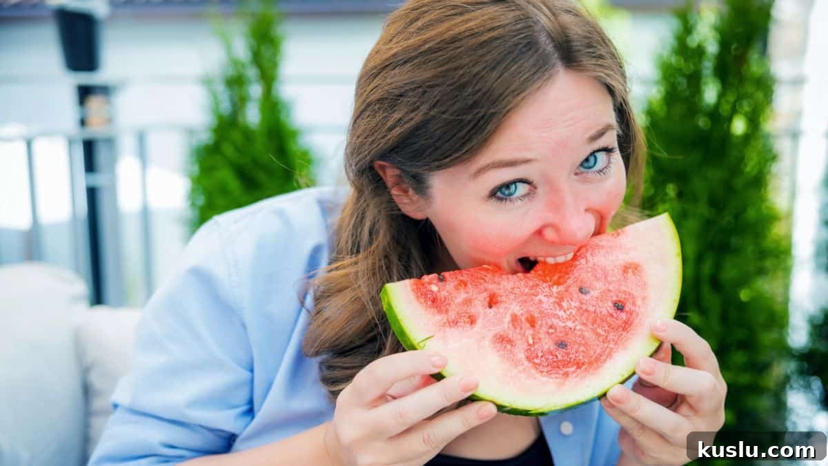 happy woman eating watermelon