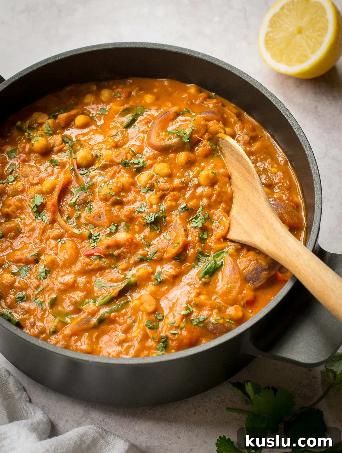Creamy Chickpea and Lentil Curry Recipe for Comforting Weeknight Meals 6 stirring a chickpea and lentil curry