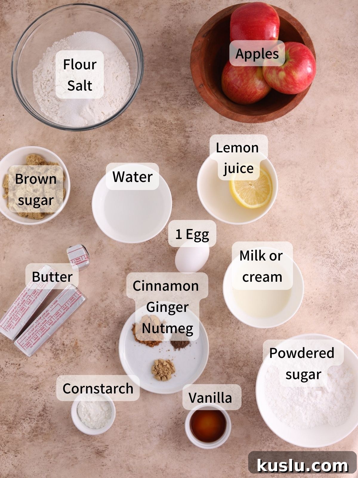 Homemade Apple Pop-Tarts Recipe for Flaky Pastry Filling 3 Labeled ingredients needed to make apple pop tarts laid out on a table.