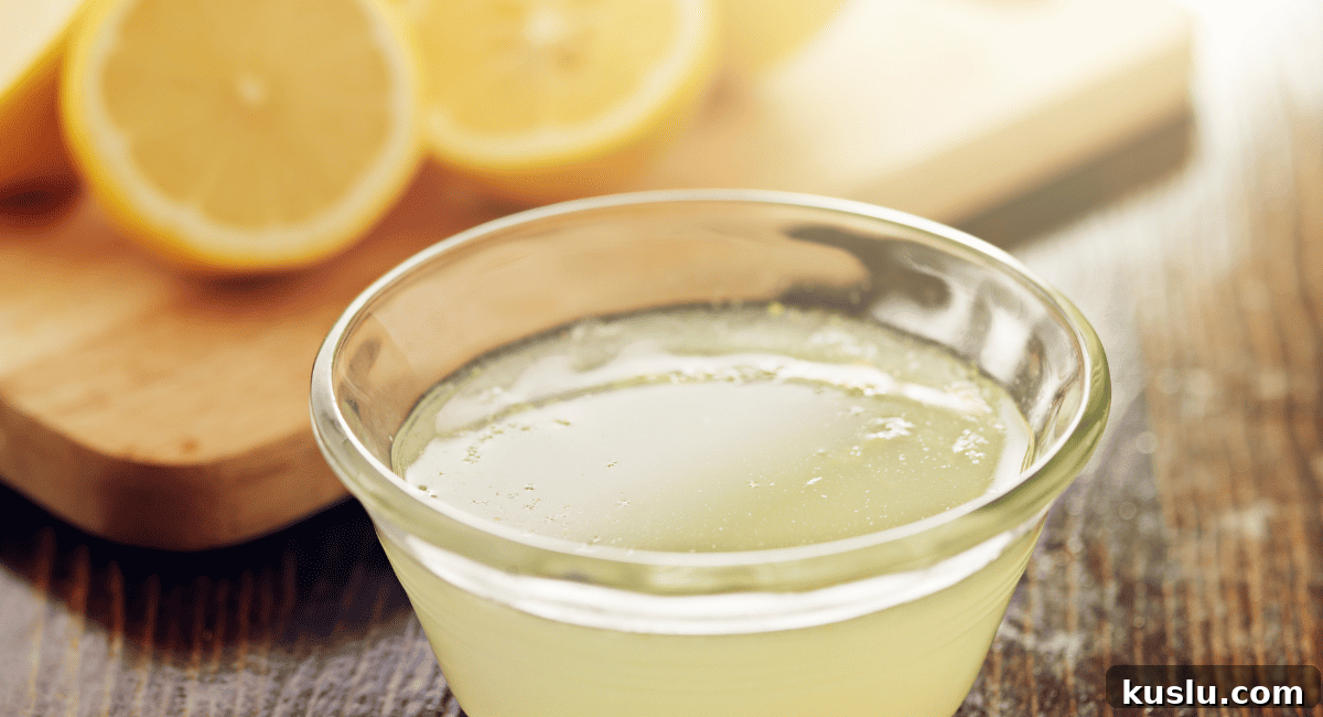 Up close image of lemon juice in glass container.