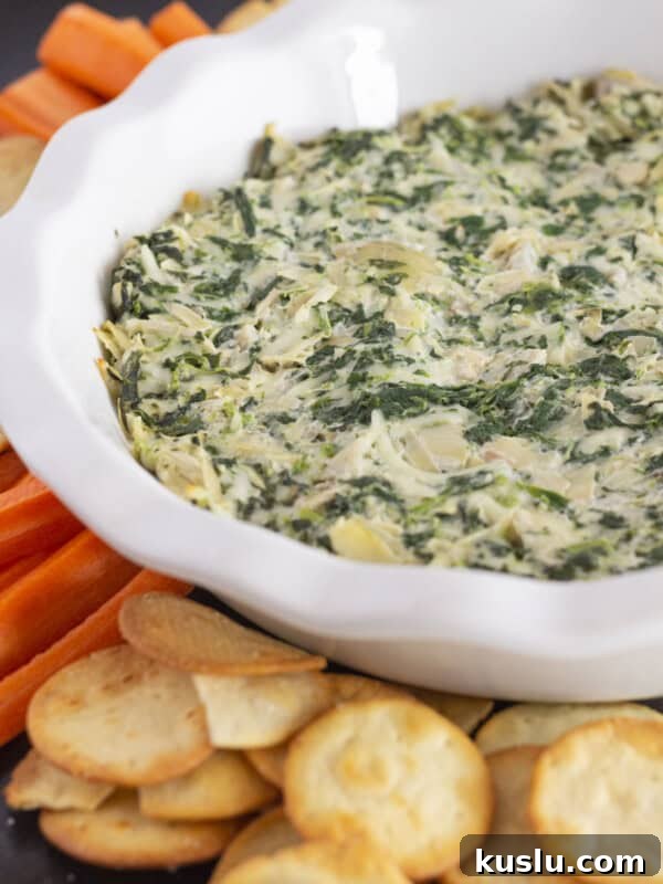 Pepperoni Pizza Football Cheese Ball Recipe: Game Day Appetizer 10 Serving spinach and artichoke dip without mayo and with crackers and carrots.