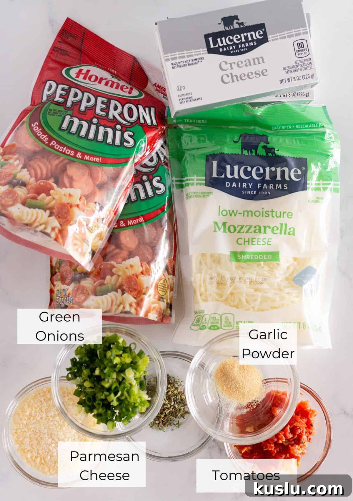 Pepperoni Pizza Football Cheese Ball Recipe: Game Day Appetizer 3 The ingredients needed to make a football pepperoni pizza cheese ball.