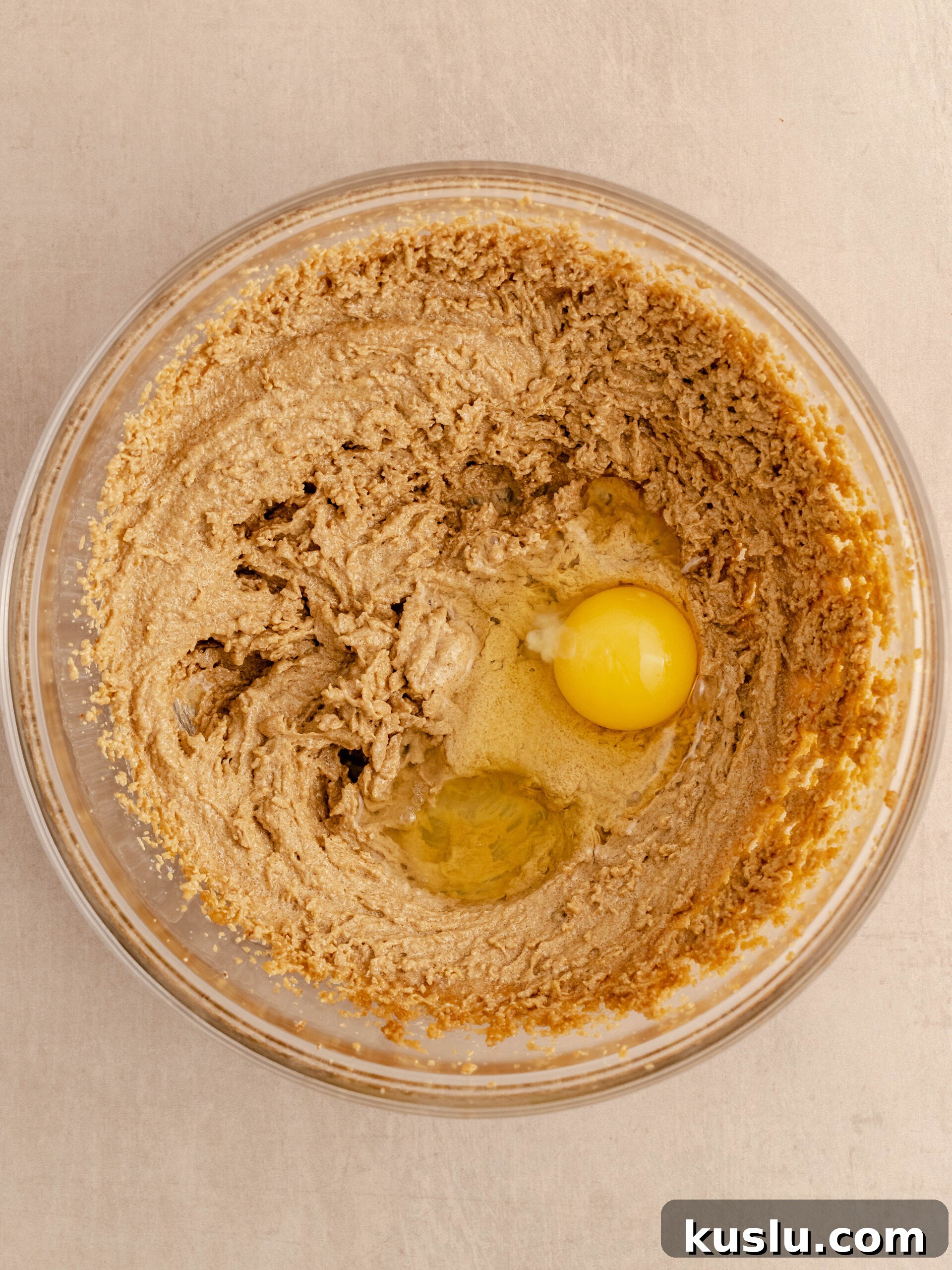 Egg and vanilla extract added to the mixture.
