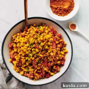 Overhead photo of a bowl of golden cauliflower rice.
