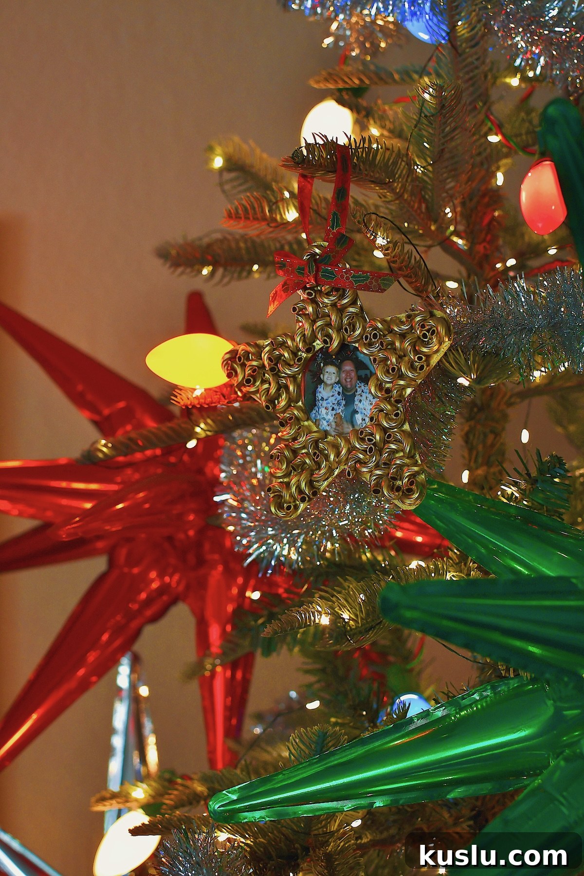 Macaroni Start Pasta Christmas Ornament, on a beautifully decorated tree.