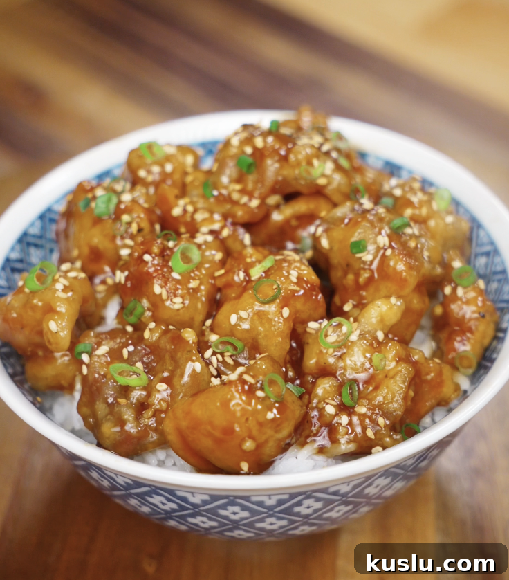 Crispy Korean Fried Chicken Recipe: How to Make Dakgangjeong 2 The sticky glazed Korean fried chicken is served over rice and topped with sesame seeds and scallions.