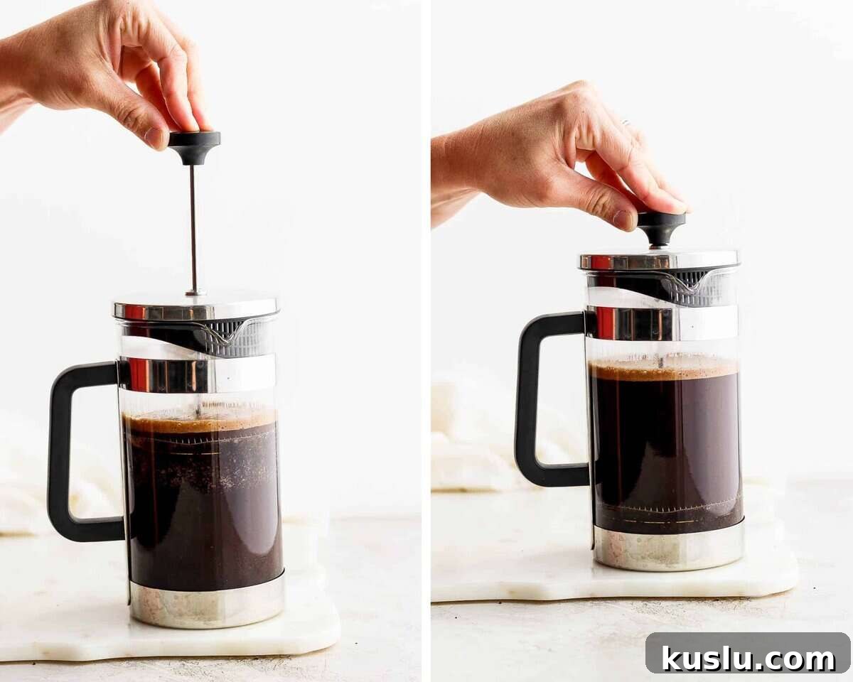 Two images showing a hand pushing down the plunger of the french press to strain the coffee.