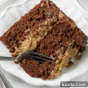 Gluten-Free German Chocolate Cake Recipe — Decadent & Moist 14 Slice of German chocolate cake with a fork taking a bite