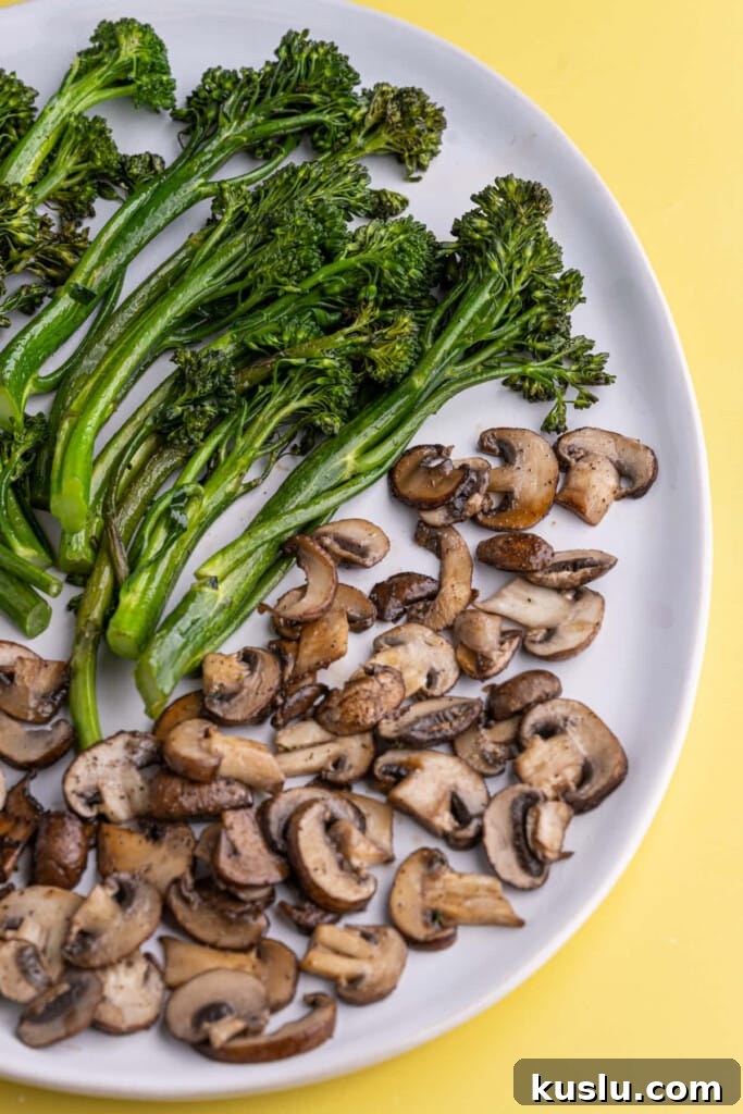 15-Minute Sautéed Broccolini with Garlic Mushrooms 11 Large serving plate with sauteed vegetables