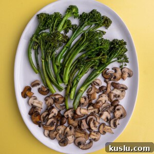 15-Minute Sautéed Broccolini with Garlic Mushrooms 12 Sauteed Broccolini and Mushrooms on a white serving plate