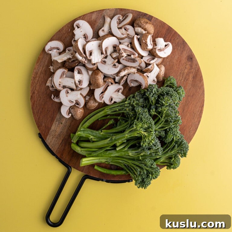 15-Minute Sautéed Broccolini with Garlic Mushrooms 13 Overhead shot of prepped broccolini and mushrooms