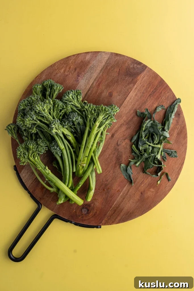 15-Minute Sautéed Broccolini with Garlic Mushrooms 6 Removing leaves from broccolini to sauté.