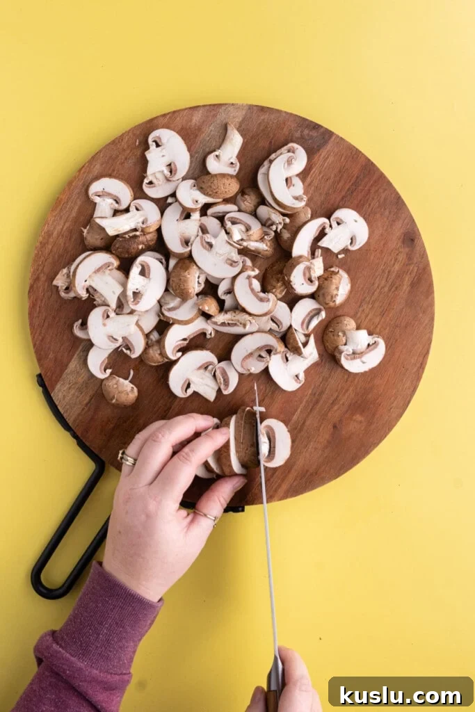 15-Minute Sautéed Broccolini with Garlic Mushrooms 7 Slicing baby bella mushrooms.