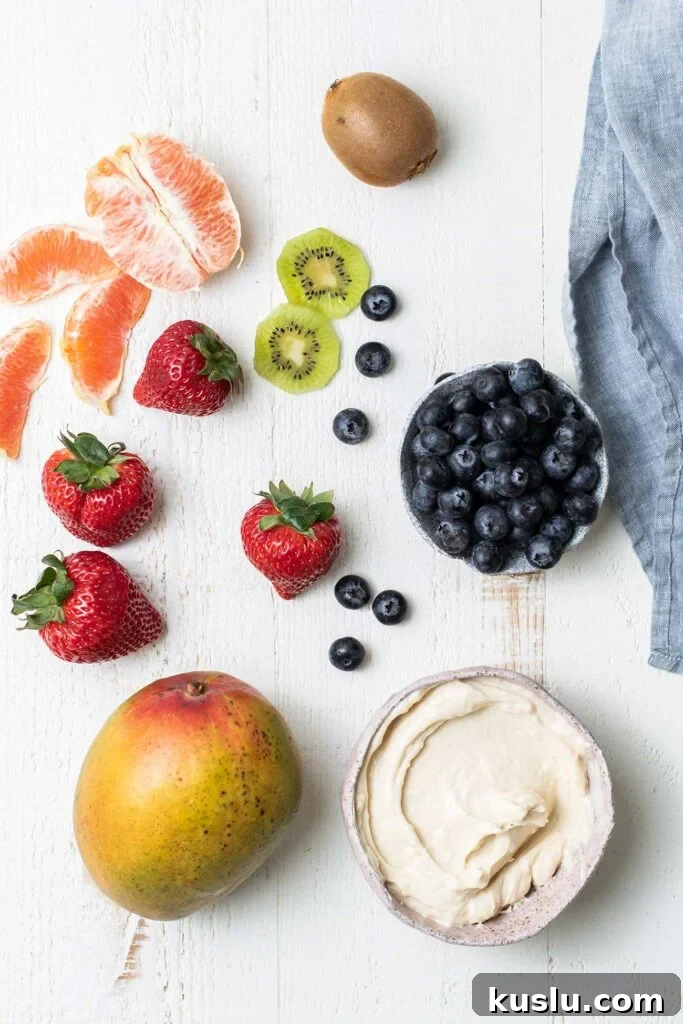 Fresh Fruit Pizza on a Crisp Cookie Crust: Summer Dessert Recipe 3 A selection of fruit shown as options for topping a fruit pizza.