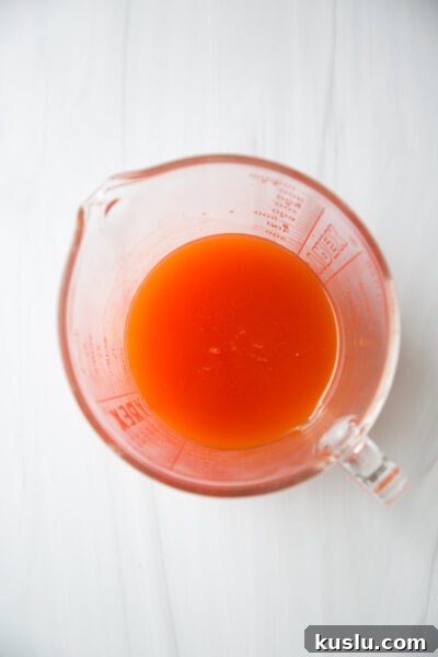 kimchi juices in a cup measure