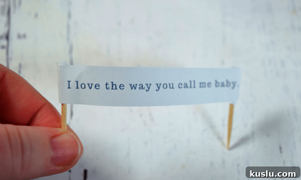 Using a toothpick to create a love note banner.