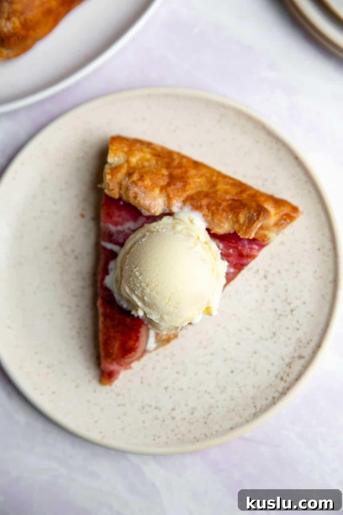a slice of pie topped with ice cream