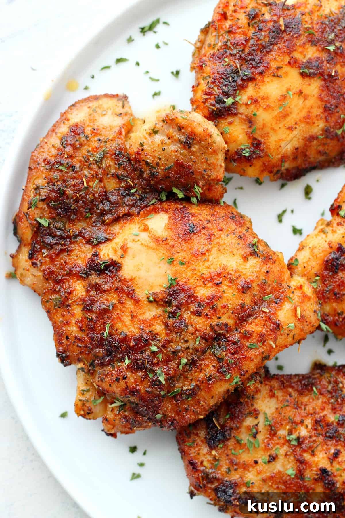 How to make the best pan fried chicken thighs. Cooked chicken thigh close up.