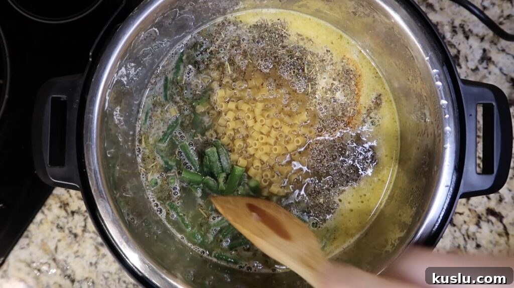 Instant Pot White Minestrone Soup Recipe for Quick Comfort 14 Stirring pot