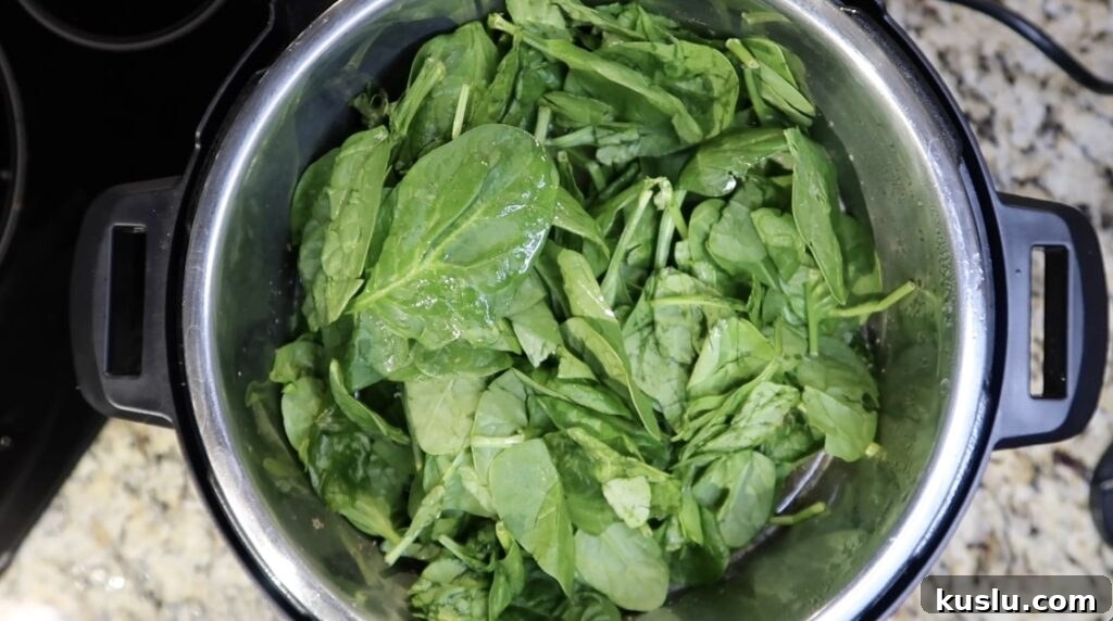 Instant Pot White Minestrone Soup Recipe for Quick Comfort 15 Topping pot with spinach