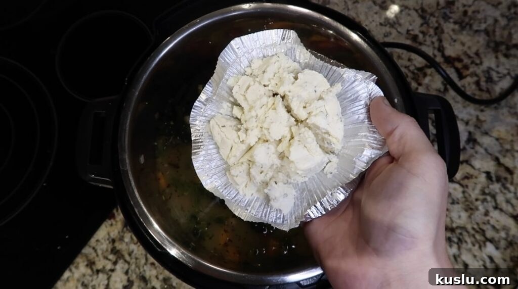 Instant Pot White Minestrone Soup Recipe for Quick Comfort 18 Adding herb cheese to soup