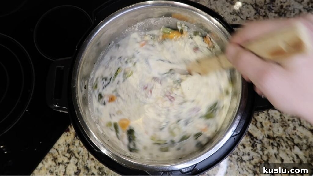 Instant Pot White Minestrone Soup Recipe for Quick Comfort 21 Stirring until dairy is combined with the soup