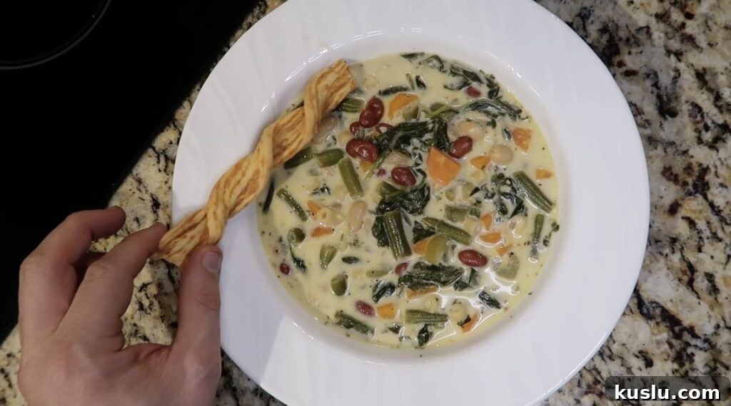 Instant Pot White Minestrone Soup Recipe for Quick Comfort 23 Soup in bowl with cheese crisp next to it