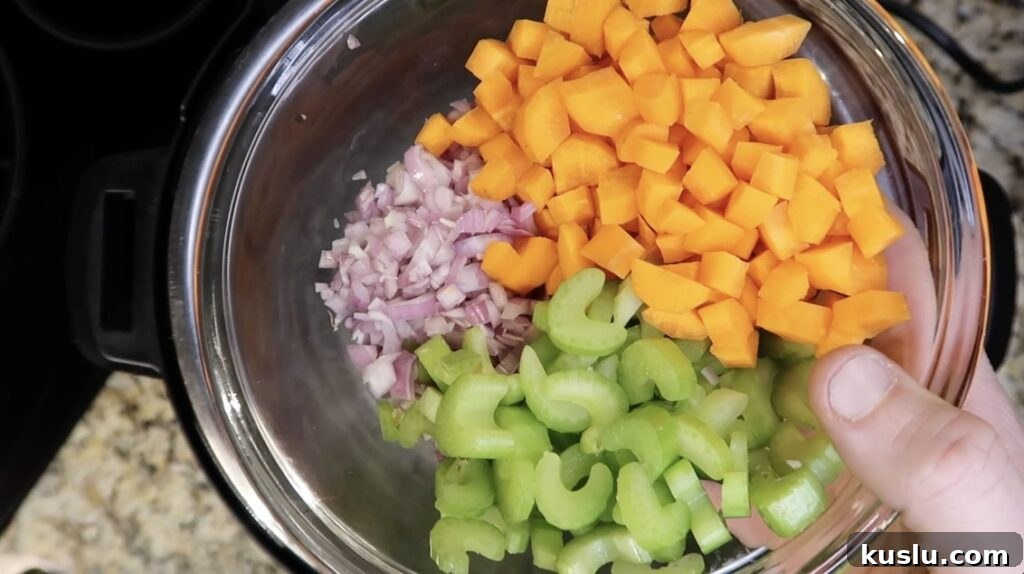 Instant Pot White Minestrone Soup Recipe for Quick Comfort 5 Adding mirepoix to pot