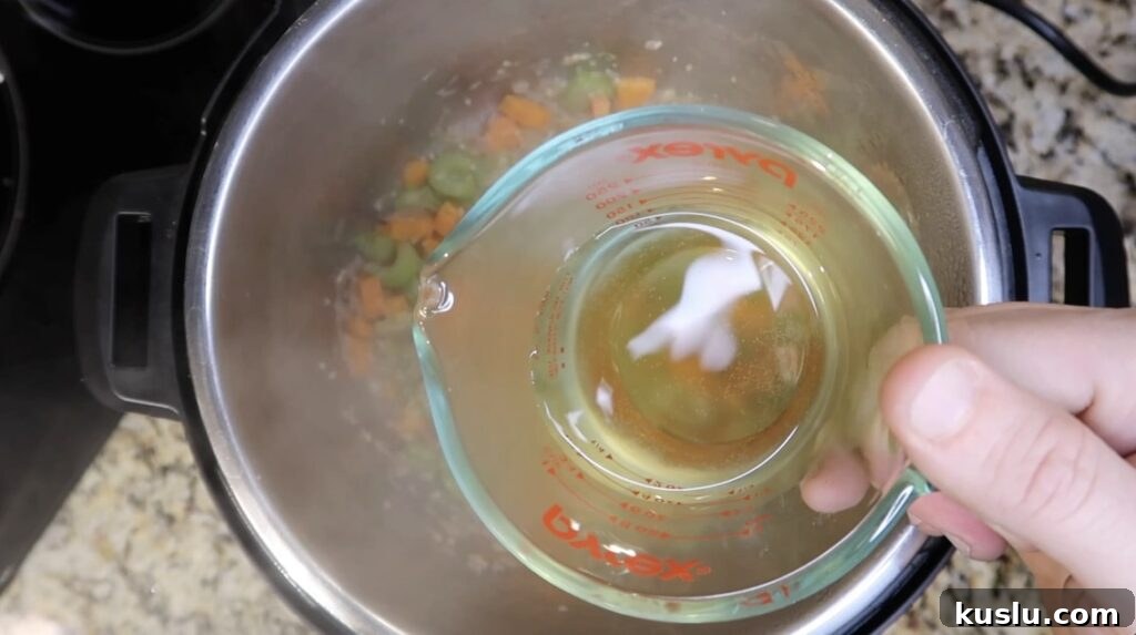 Instant Pot White Minestrone Soup Recipe for Quick Comfort 8 Adding white wine to pot