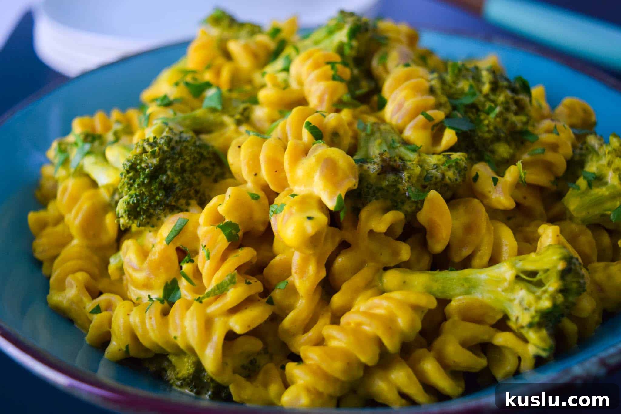 Secret Ingredient Roasted Broccoli Rotini on blue plate close up