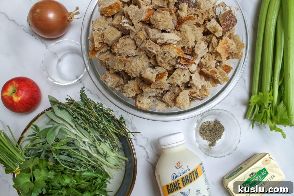 ingredients for stuffing: onion, salt, apple, herbs, sourdough bread, chicken broth, pepper, butter, and celery