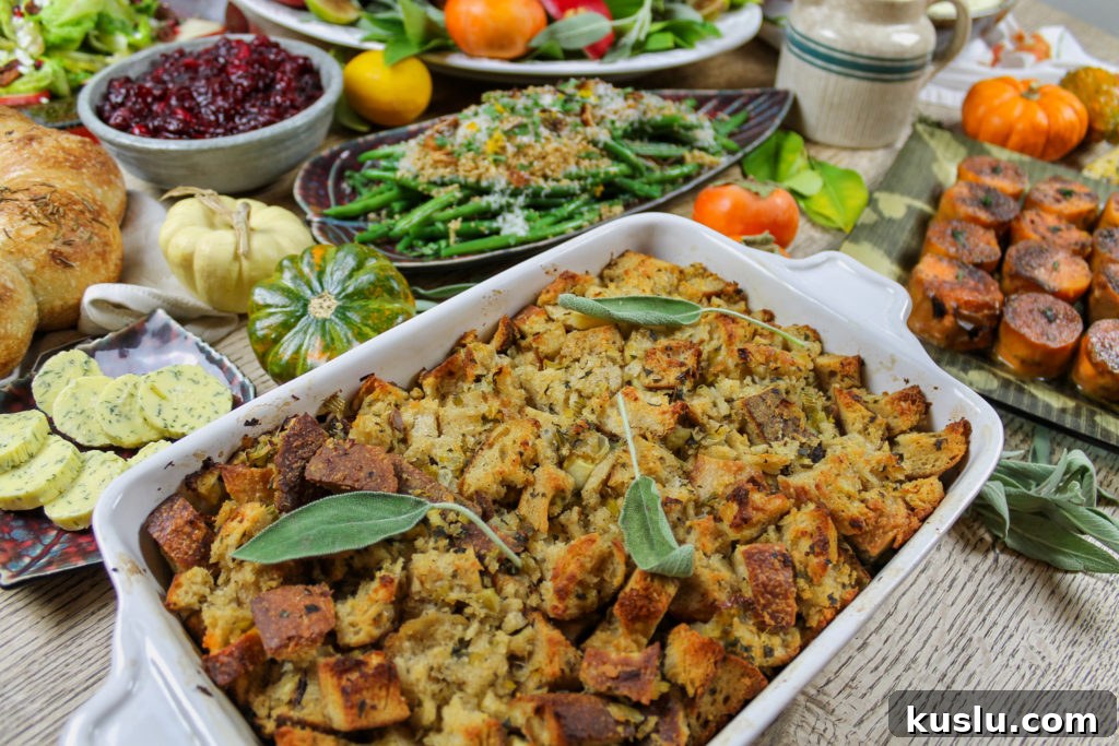 stuffing on thanksgiving table with butter, green beans, sweet potatoes, cranberry sauce