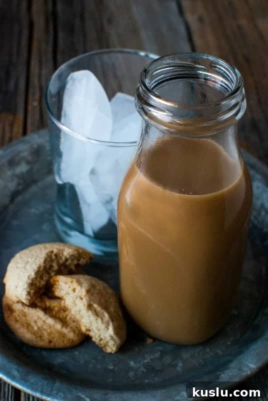 starbucks frappuccino in a jar next to cookies and glass with ice 