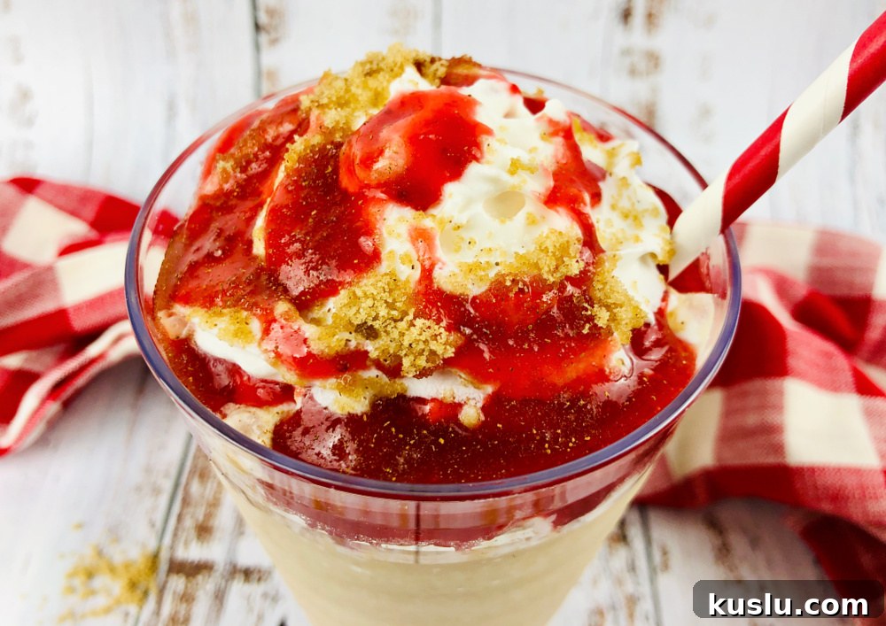 Strawberry Funnel Cake Frappuccino Recipe (Copycat Starbucks) 9 Pouring the Frappuccino