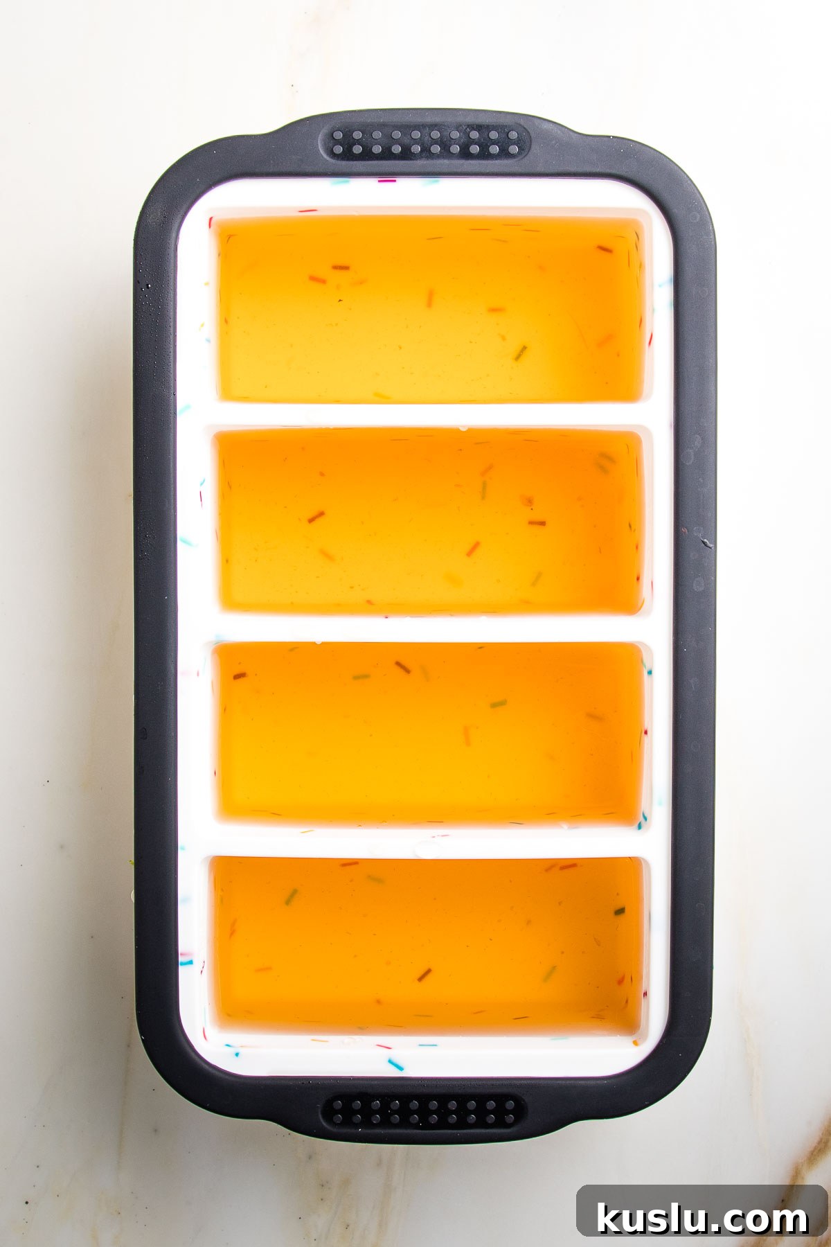 How to Make Flavorful Homemade Vegetable Broth from Scratch 6 Silicone ice cube mold filled with vegetable broth in 4- 1 cup sections.