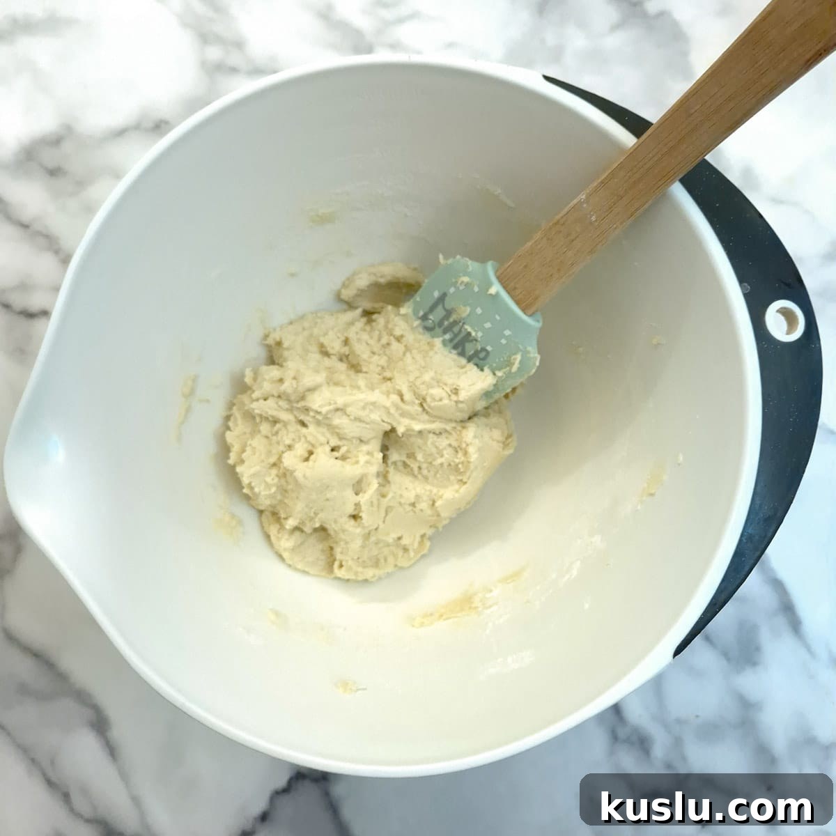 Flour mixed in to form a thick sticky dough.