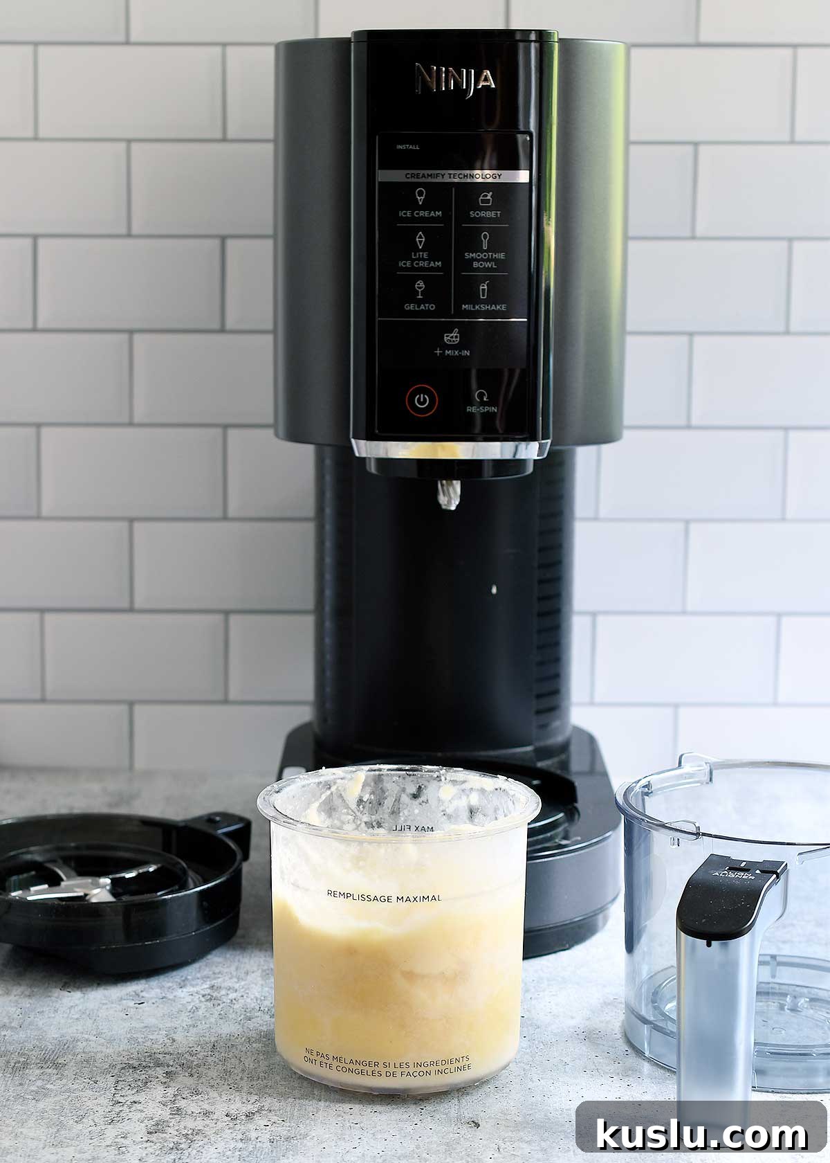 Vegan Dole Whip for Ninja Creami — Refined Sugar-Free Recipe 2 Ninja Creami with a pint of pineapple sorbet ready to spin.