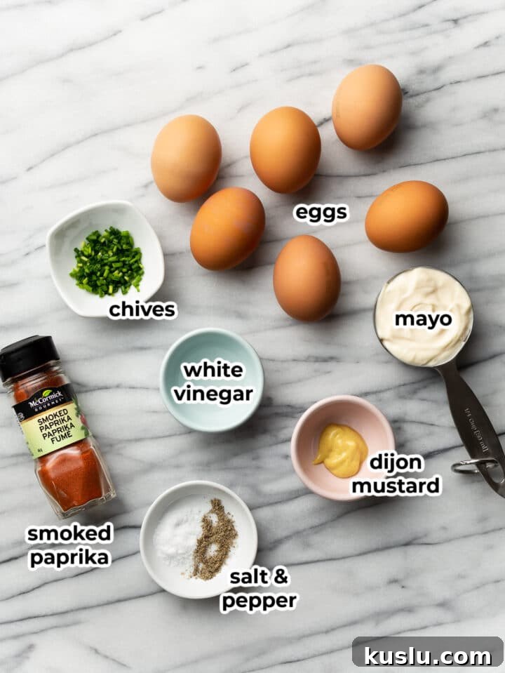 Classic Southern Deviled Eggs Recipe for Parties and Holidays 3 ingredients for deviled eggs on a marble surface