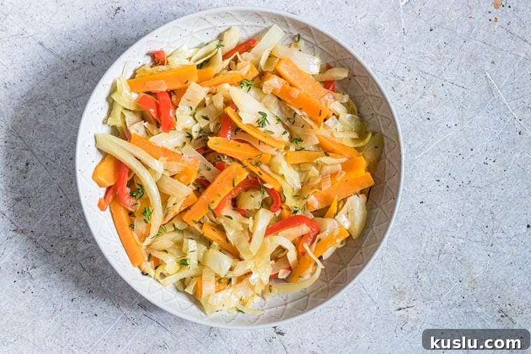 close up view of steamed cabbage in a ceramic bowl
