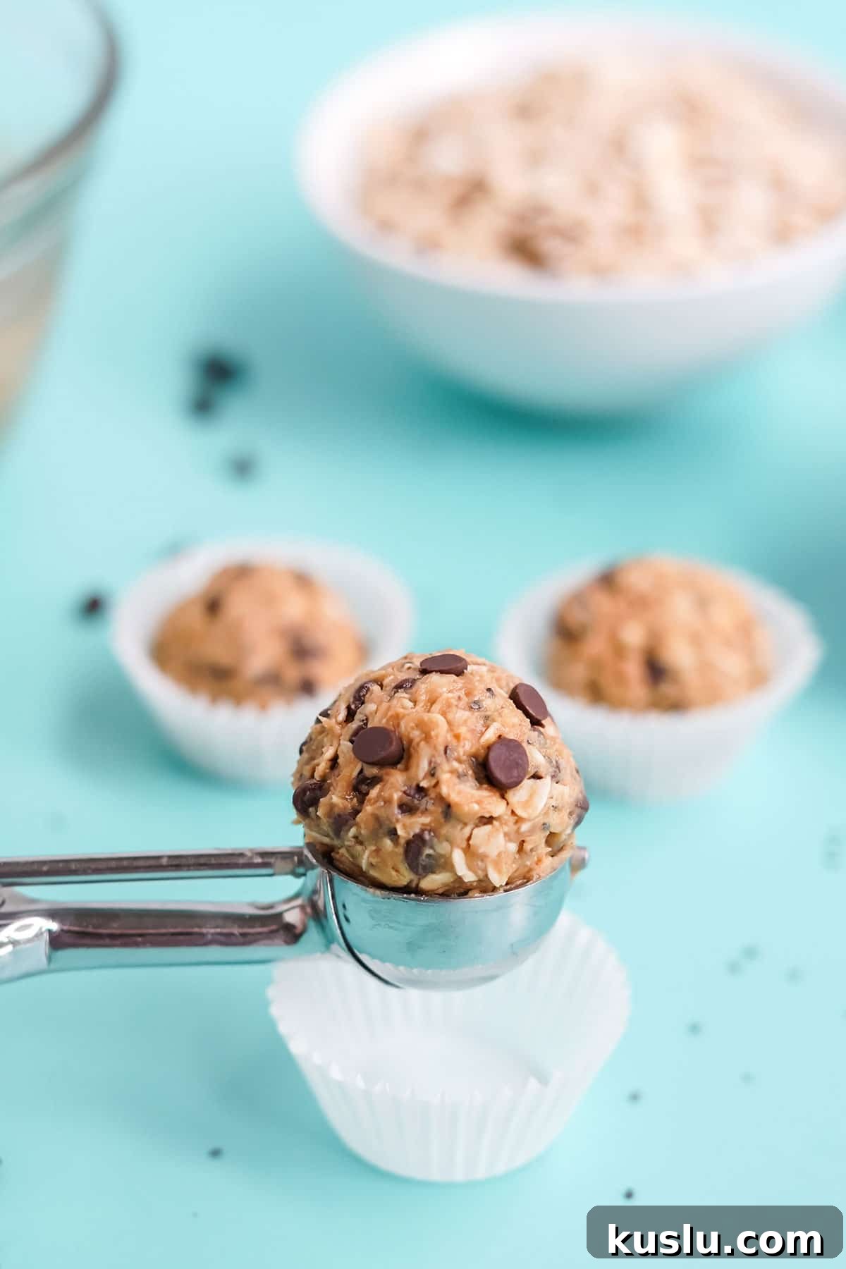Peanut butter protein ball in a cookie scoop.
