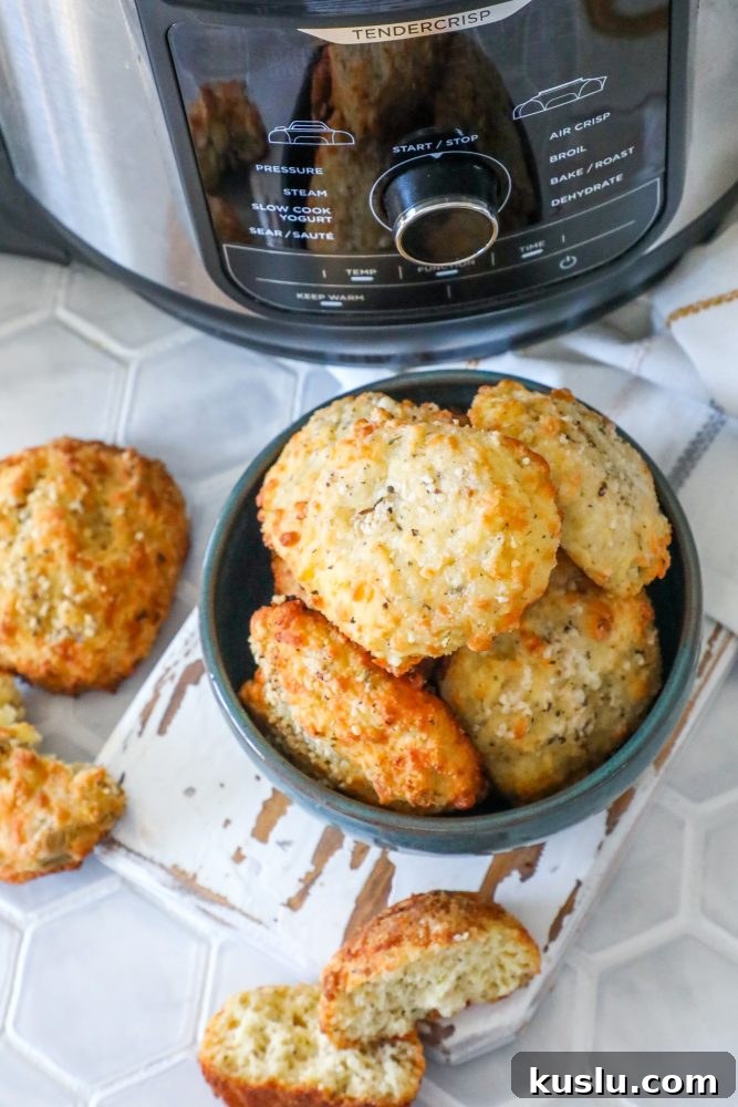 Keto air fryer rolls with cheesy biscuits in front of an instant pot.