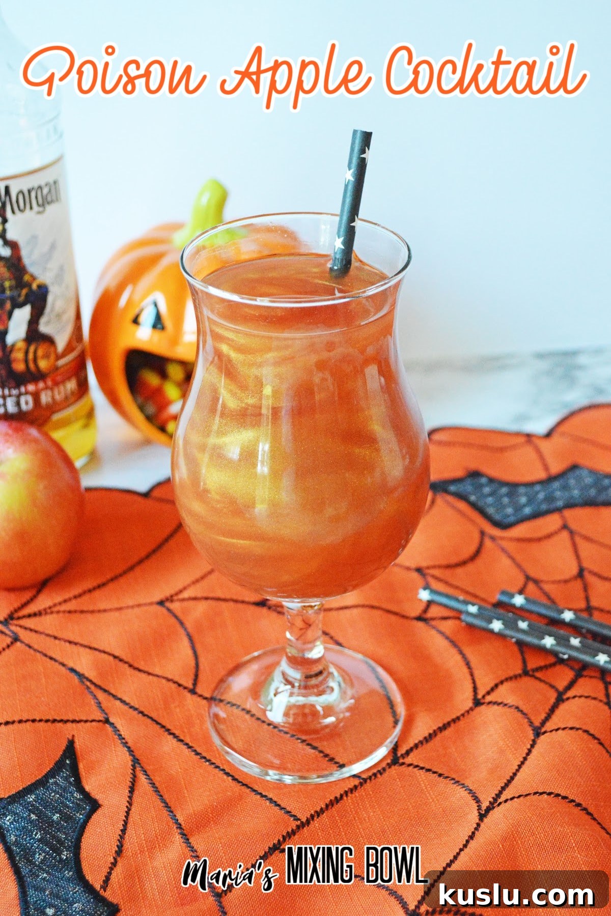 glass of poison apple cocktail on a siderweb towel