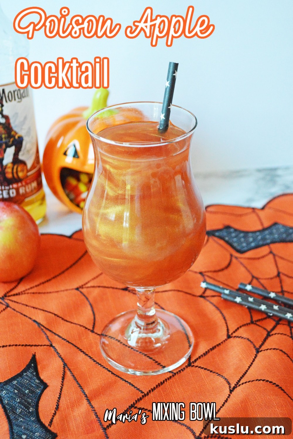 glass of poison apple cocktail on a siderweb towel